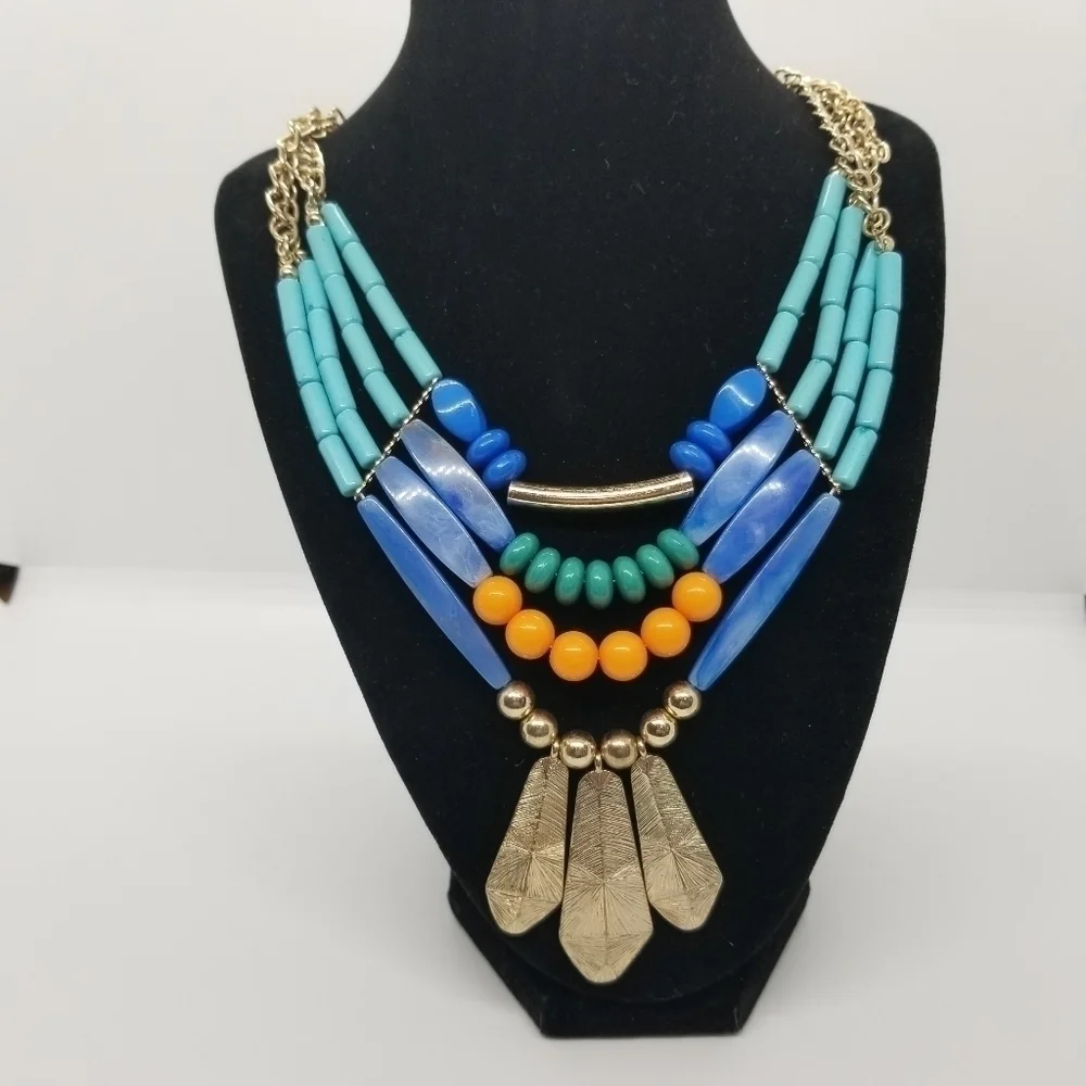 layered multicolor bib necklace with feather-like pendants